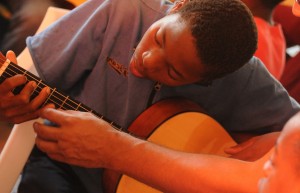 boy playing guitar