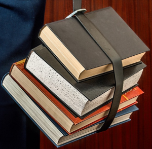 a student holding books